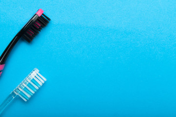 Hygienic toothbrushes for cleaning teeth on a blue background. Copy space for text.