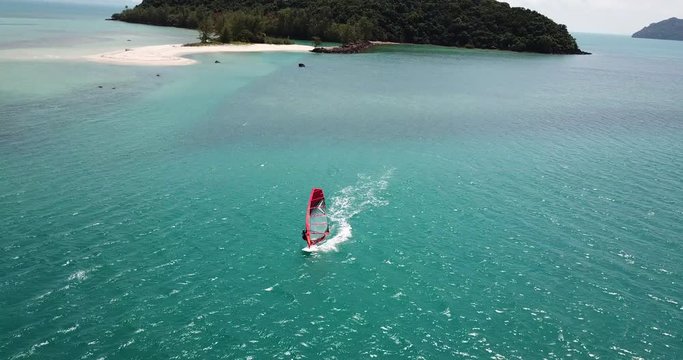 RomanchikAERIAL 4K: Wind surfing,surfer in the open sea on a windy day at a koh Phangan island,Thailand