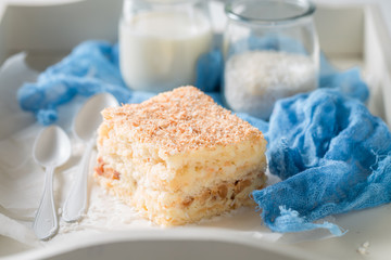 Yummy coconut cake with nuts and foam