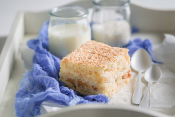 Homemade coconut cake with nuts and foam