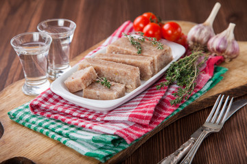 Homemade jelly meat with mustard  on the table. Holodets. Selective focus. Copy space.
