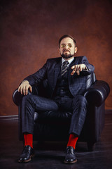 Businessman with the golden Bitcoins, Ticker Symbol BTC finance money bitcoin concept.