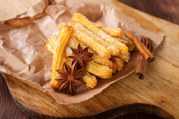 Spanish dessert: churros on the table. Selective focus. Copy space.