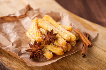 Spanish dessert: churros on the table. Selective focus. Copy space.