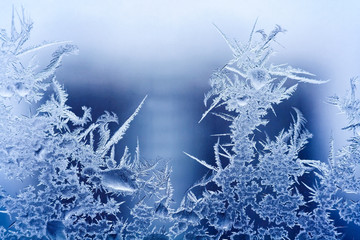 Frosty pattern on the glass. Abstract, background, toned