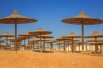 Parasols on the beach of Red Sea in Hurghada, Egypt