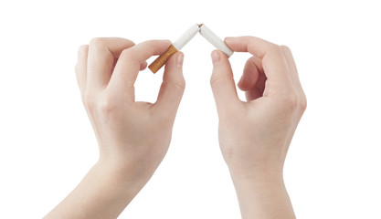 hands holding broken cigarette. quit smoking concept