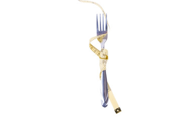 Diet eating. Measuring tape wrapped around fork
