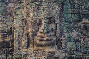 Fototapeta na wymiar Carved face in Bayon temple, Angkor, Cambodia