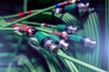 Acoustic audio cable server Green audio cable. Many acoustic cables. Сoaxial cable for data transmission server. Close up. multiple exposure	