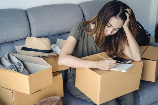 Stressed asian business woman working online business