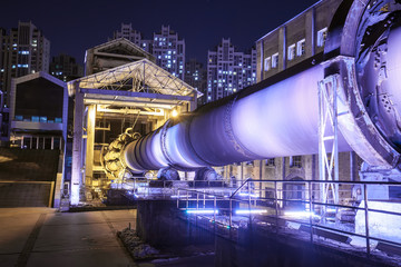 Factory buildings and industrial equipment in the evening