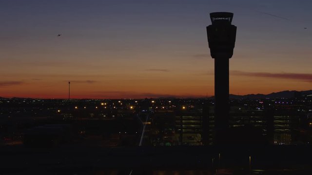 Airport traffic control tower and the city