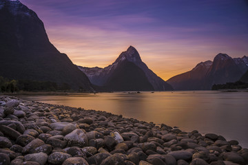 Beautiful sunset in Milford Sound, Fiordland National Park, South island, New Zealand with a colorful sky.