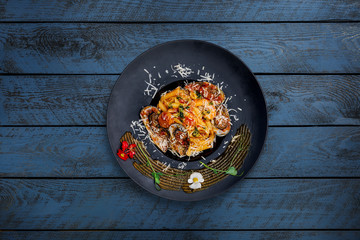 Pasta with seafood in tomato sauce.