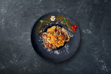 Pasta with seafood in tomato sauce.