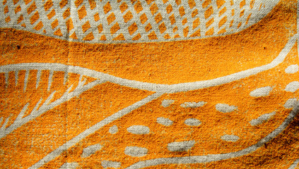 closeup photo of a yellow block print artwork on cotton fabric
