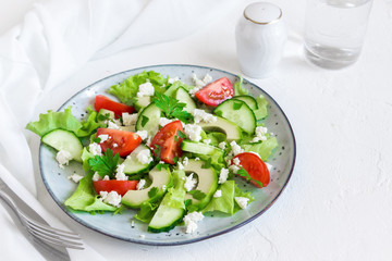 Avocado, feta and vegetables salad