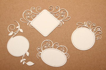 Round, square and rectangular wooden frames with curls, for text