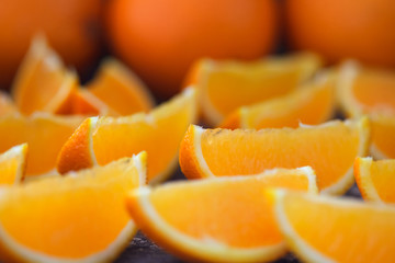 Naklejka na ściany i meble Fresh healthy orange slices on wooden table. 