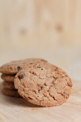Cookies are stacked on a wooden table