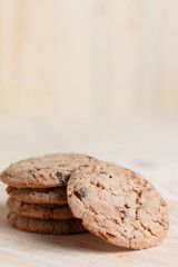 Cookies are stacked on a wooden table