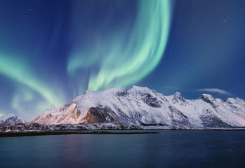 Northen light under mountains. Beautiful natural landscape in the Norway
