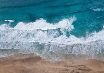Aerial view on the beach and waves. Beautiful natural landscape from air
