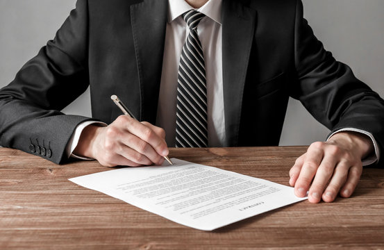 Close up businessman signing contract making a deal, business and success concept