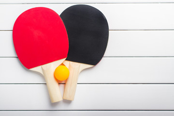 Ping-pong table tennis on white wooden background top view