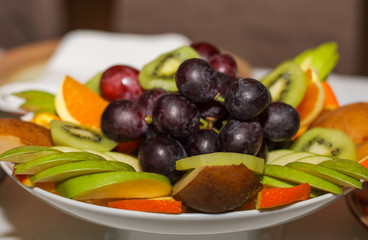 Naklejka na ściany i meble beautifully laid out fruit in plate closeup