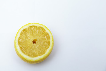 yellow lemon in a cut on a white background