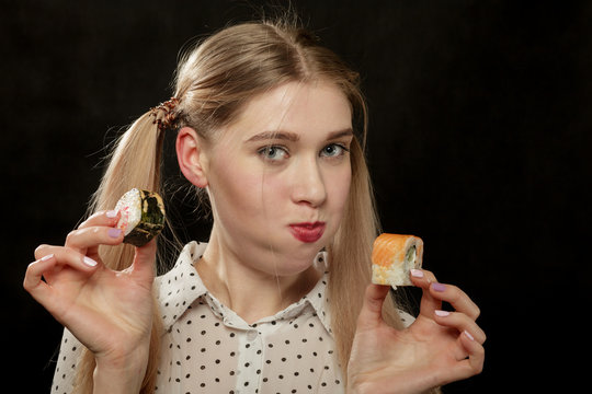 woman eats sushi