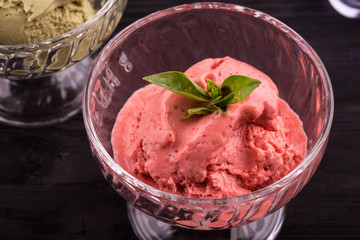 Ice cream sorbet with greens, is served in an ice-cream bowl