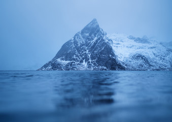 Mountains reflection on water surface. Beautiful natural landscape in the Norway