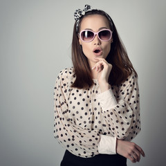 Fototapeta premium Pinup girl. Vintage portrait of young attractive woman in retro pin-up style.