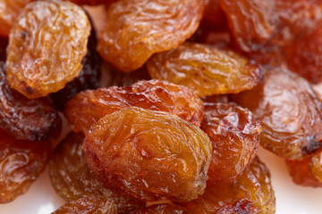 Raisins on a white background. Dried grapes.