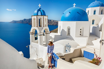 Young woman travels to Santorini