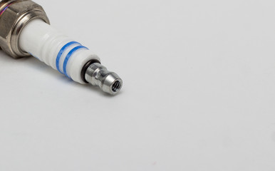 Car engine spark plug on white background