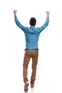 back view of a casual man celebrating success