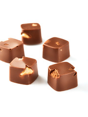 Assortment of chocolate candies sweets isolated on a white background. Chocolate candies collection. Milk chocolate with nuts.