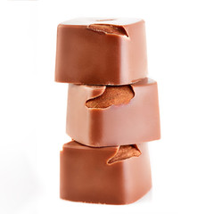 Assortment of chocolate candies sweets isolated on a white background. Chocolate candies collection. Milk chocolate with nuts.