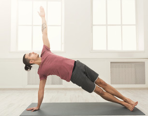 Fitness man plank training indoors