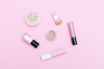 Obraz premium Nude cosmetics on pink background. Flat lay