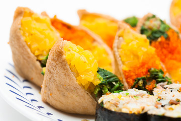 Sushi and gimbap on a plate isolated 