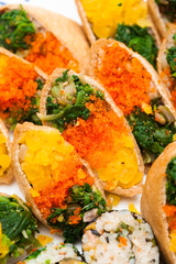 Sushi and gimbap on a plate isolated 
