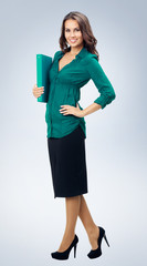 Businesswoman with blue folder, on grey