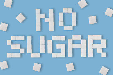 Fototapeta na wymiar Word No sugar written with sugar cubes