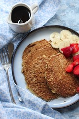 Homemade Oat  wheat Bran Pancakes served with fresh strawberries and banana