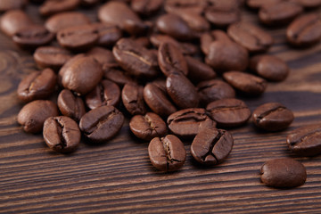 Coffee beans on wooden background